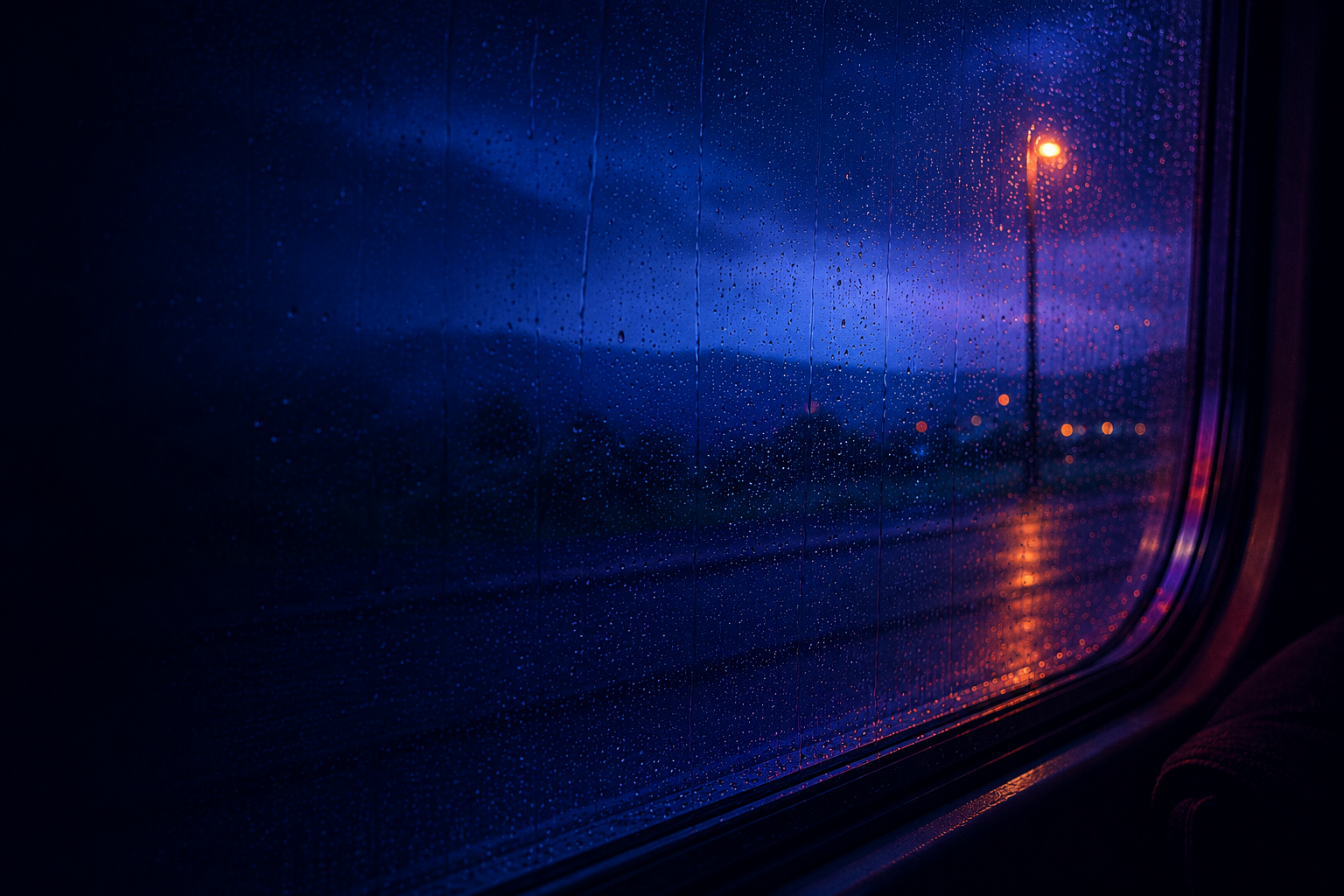 Rainy city window at night